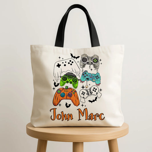 Tote bag with colorful gaming controller designs and  name text on a beige background
