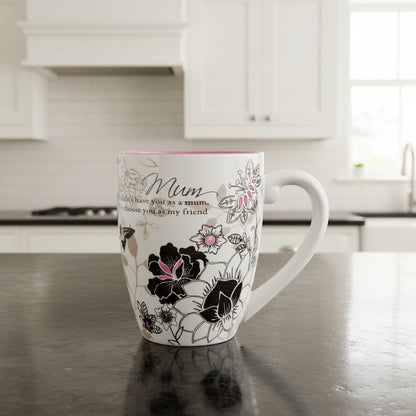 Mug with floral design and text on a white background