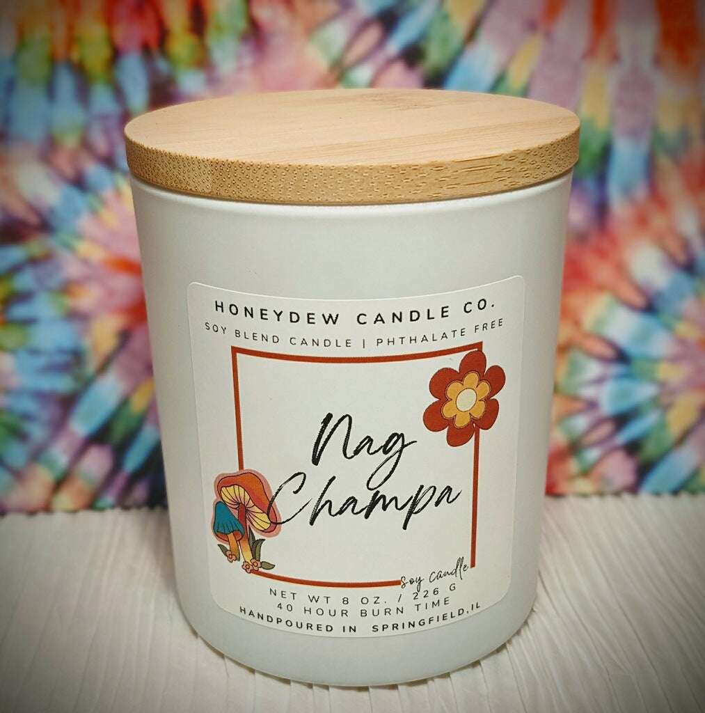 Candle with a wooden lid and colorful tie-dye background