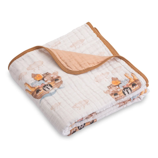Quilted blanket with cartoon animal design on a white background