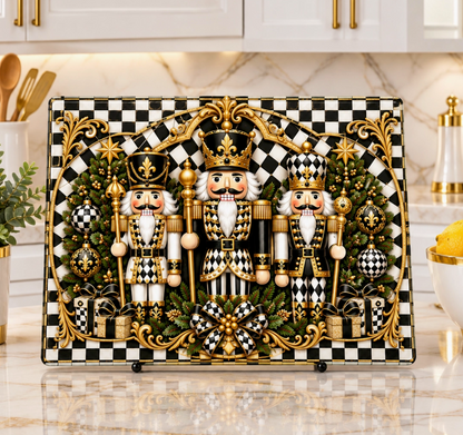 Nutcracker black and white check glass cutting board displayed upright as festive Christmas kitchen decor

