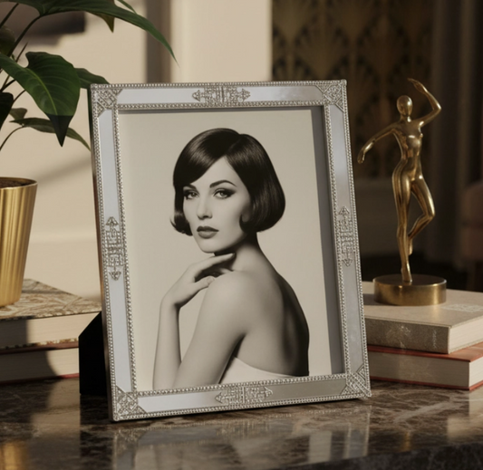 Framed portrait on a table with decorative items