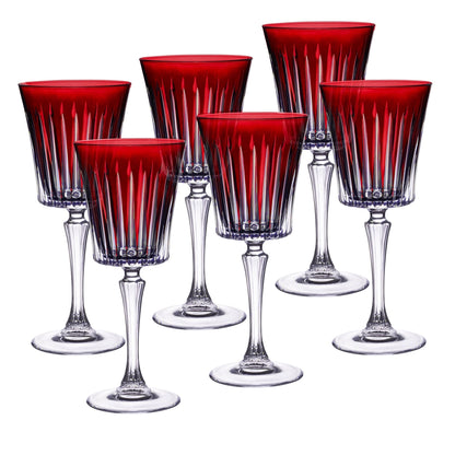 Set of six red and clear glass goblets on a white background