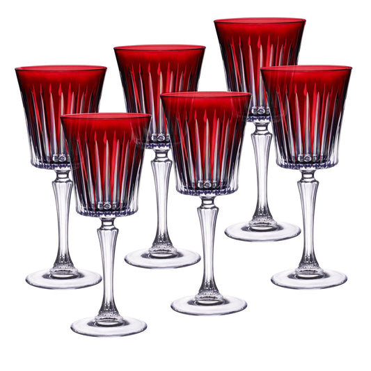Set of six red and clear glass goblets on a white background