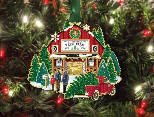 Christmas ornament depicting a cabin, truck, and people on a tree farm against a Christmas tree background.