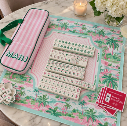 Palm Resort Mahjong tiles displayed on coordinating pink green and aqua tropical Mahjong mat with striped MAHJ storage bag