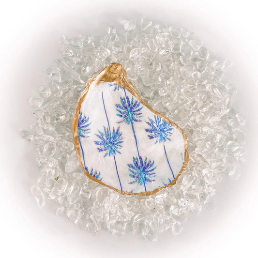 Decorative shell with blue Palm Tree pattern on a white background