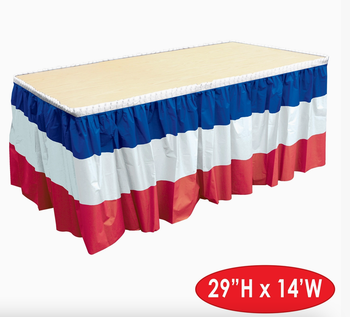 Table skirt with red, white, and blue pattern on a beige table.