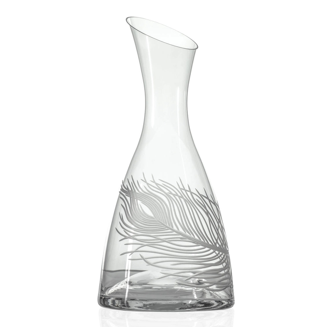 Clear glass carafe with leaf design on a white background