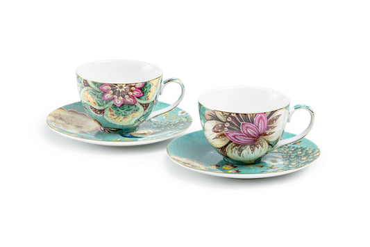 Two floral teacups with saucers on a white background