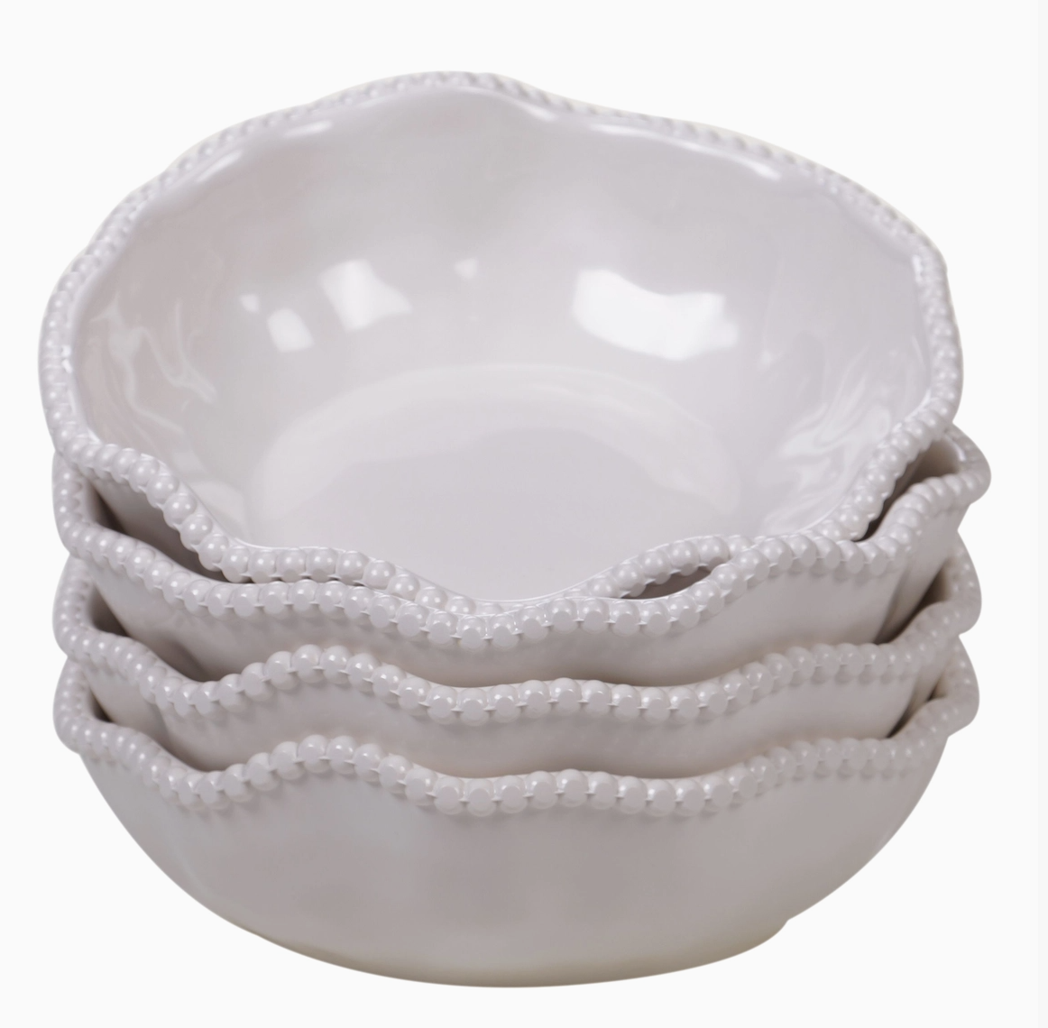 Stack of Certified International Perlette cream melamine bowls with beaded ruffled rims