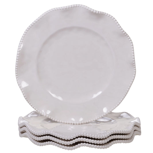 Set of white ceramic plates with decorative rims on a white background
