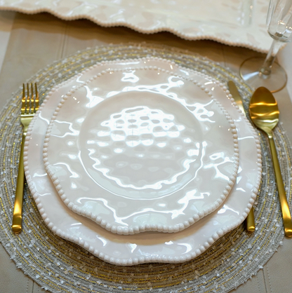 Perlette cream melamine salad plate layered over matching dinner plate with beaded ruffled rims and gold flatware