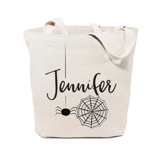 Beige tote bag with 'Jennifer' and spider web design on a white background