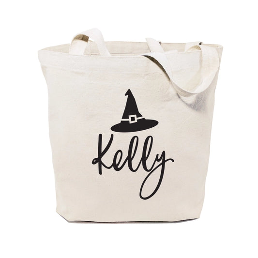 Beige tote bag with black witch hat and 'Kelly' text on a white background