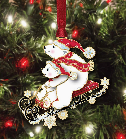 Christmas ornament with two polar bears on a sleigh against a Christmas tree background