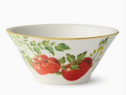 Decorative bowl with tomato and leaf design on a white background