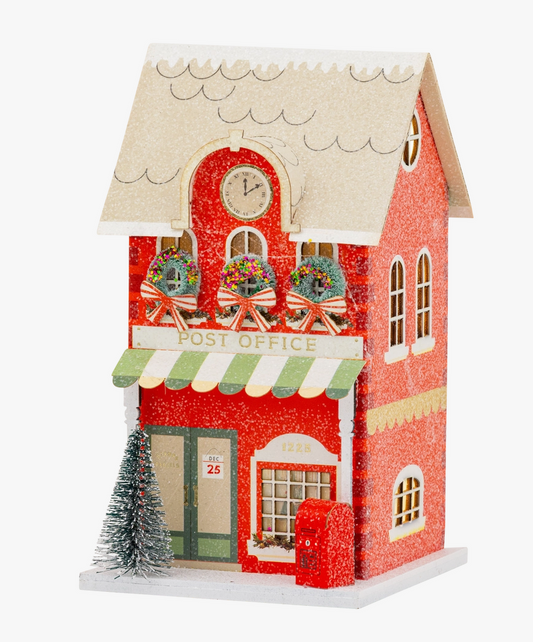 ed lighted Christmas village Post Office with green striped awning, holiday wreaths, red mailbox, snowy tree and glitter accents.
