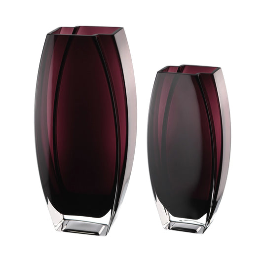 Two purple glass vases on a white background
