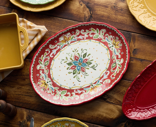 Decorative ceramic plate with floral design on a wooden table