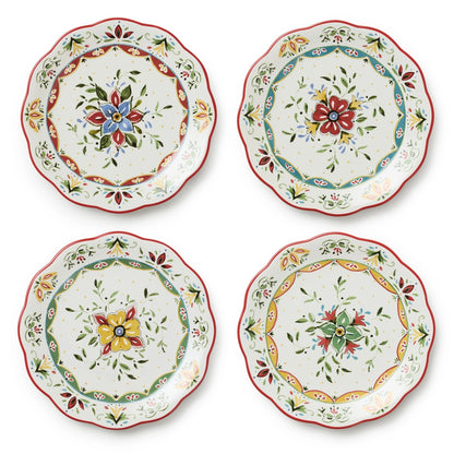 Set of four decorative plates with floral patterns on a white background