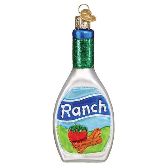 A Christmas ornament shaped like a bottle of Ranch dressing, with a silver body, green glitter neck, blue cap, and a printed Ranch label showing a red tomato and cinnamon sticks.