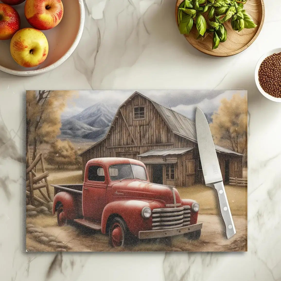 Chopping board with a red truck design on a marble surface with apples and basil.
