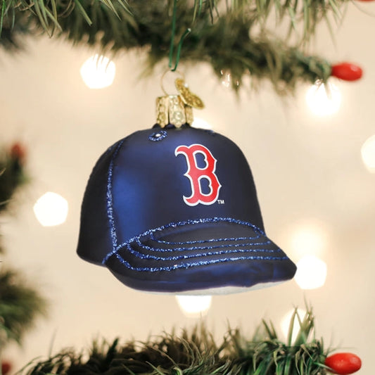 Blue baseball cap ornament with red 'B' logo on a Christmas tree.