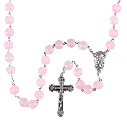 Pink rosary with a cross on a white background