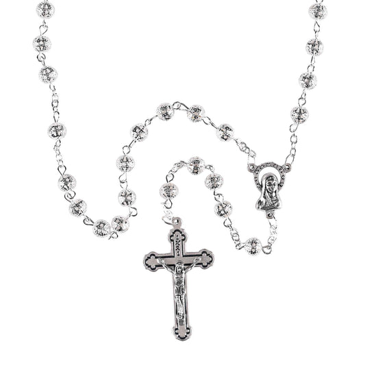 Silver rosary necklace with cross and religious figure on a white background