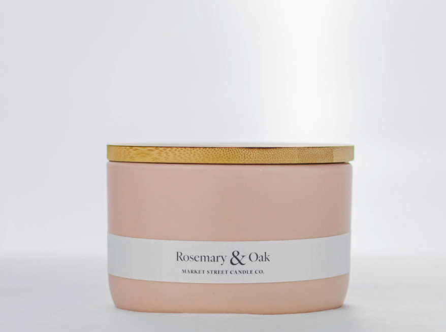 Rosemary & Oak Market Street Candle Co. 16 oz three-wick candle in a blush ceramic vessel with gold-tone lid.