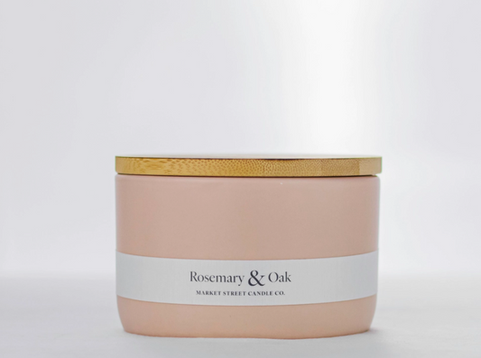 Rosemary & Oak Market Street Candle Co. 16 oz three-wick candle in a blush ceramic vessel with gold-tone lid.