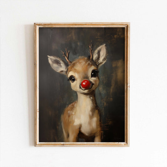 Framed painting of a deer with a red nose on a white wall