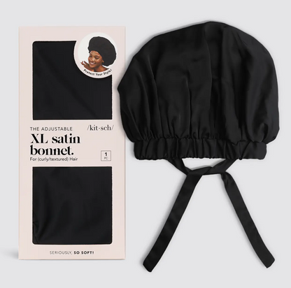 Black satin bonnet with packaging on a light gray background