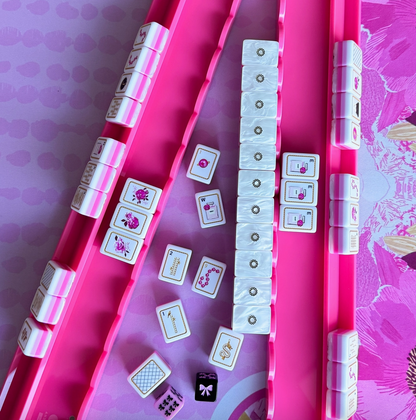 Close-up of MAHJjenta hot pink acrylic Mahjong rack with scalloped magnetic pusher and smooth 20-inch design.