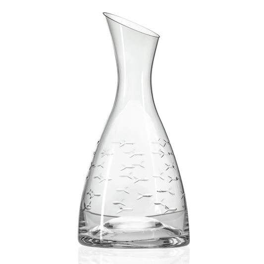 Clear glass decanter with engraved design on a white background