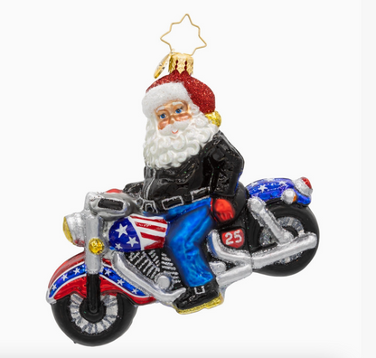 Christopher Radko Cruisin Claus Santa motorcycle glass ornament hanging on Christmas tree