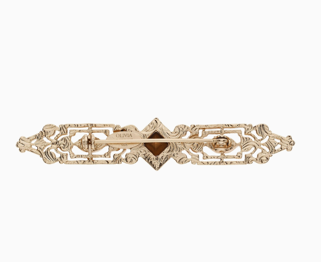 Back of Olivia Riegel gold bar brooch showing pin closure and hallmark