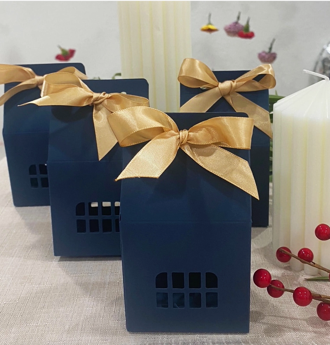 Navy and gold house shaped favor boxes for Christmas and wedding treats