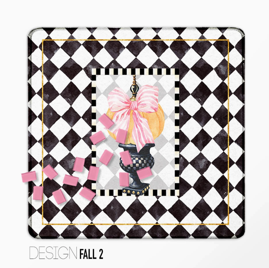 Fall Mahjong mat with pink bow, decorative pumpkin and black-and-white harlequin pattern