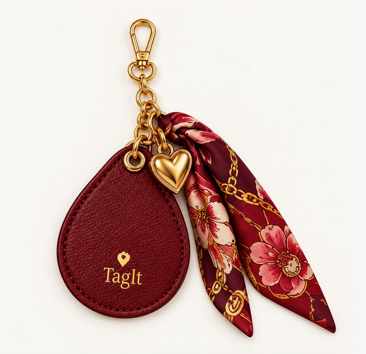 Burgundy keychain with gold-tone heart charm, floral scarf accent, and lobster clasp.