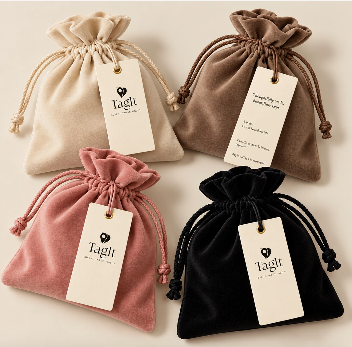 Four velvet-style drawstring dust bags in cream, taupe, blush pink, and black with gift tags.