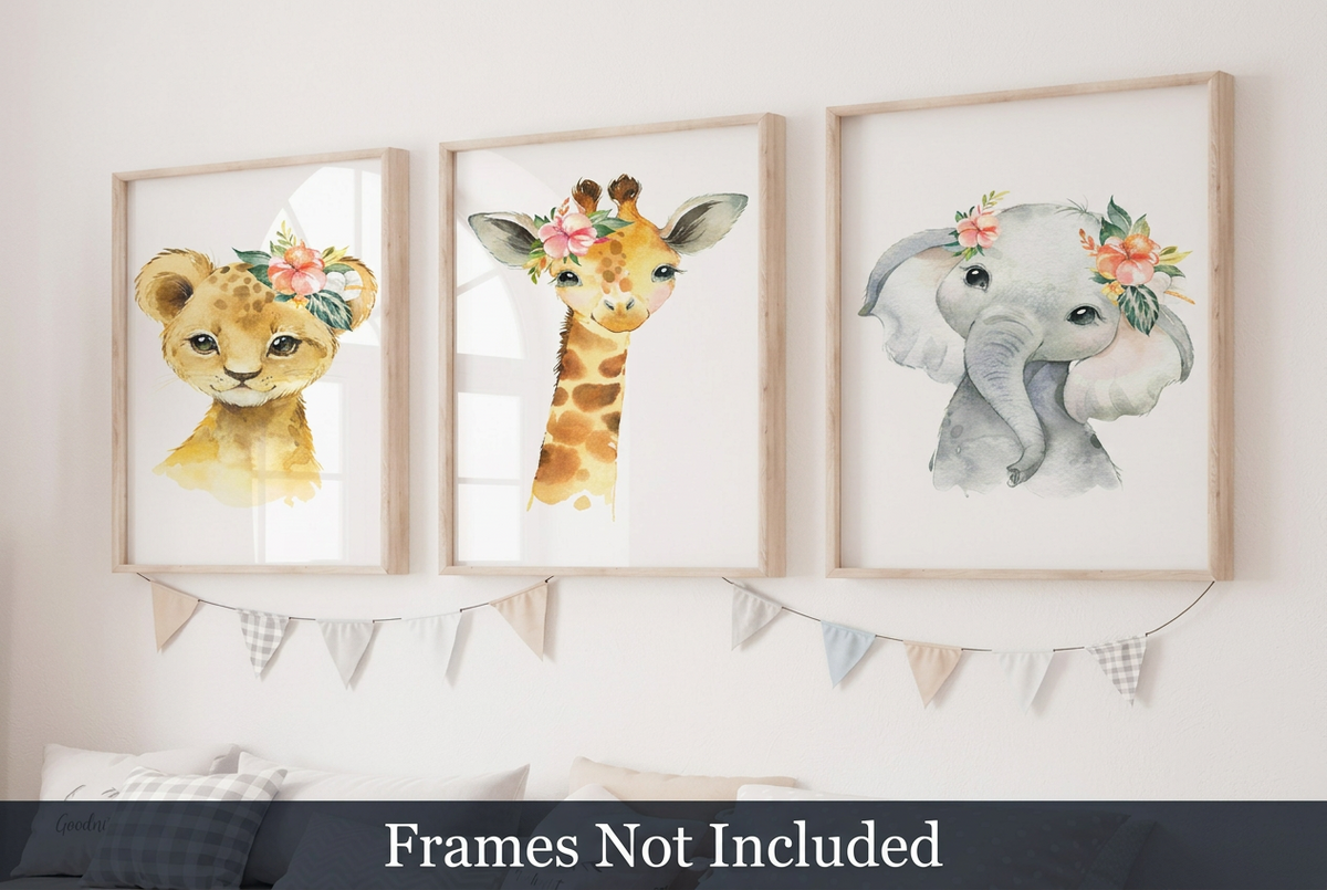 Set of three floral safari nursery wall art prints featuring a watercolor lion cub, giraffe and elephant wearing flower crowns, displayed in natural wood frames above a nursery bed.