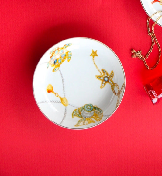 Decorative plates with floral designs on a red background
