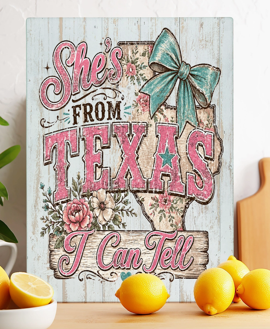 She’s From Texas I Can Tell glass cutting board with pink Texas lettering turquoise bow floral details and Texas state outline