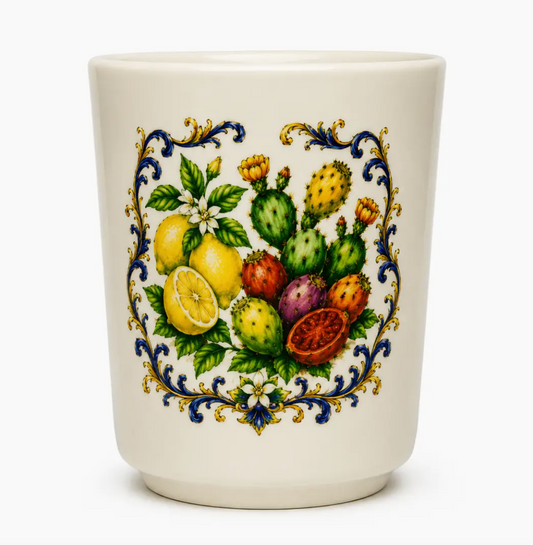 An off-white ceramic cup featuring a colorful hand-painted illustration of citrus fruits, cactus, and ornate blue and gold scrollwork on a white background. NY Gift Boutique