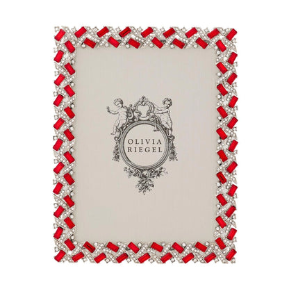 Decorative photo frame with red gemstones and silver accents on a white background, featuring the brand 'Olivia Riegel'.
