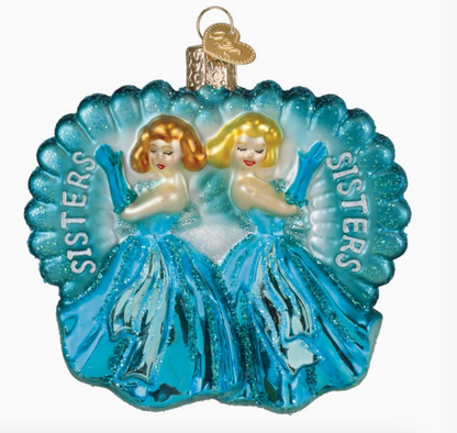 Decorative ornament with two women in blue dresses and 'SISTERS' text on a white background