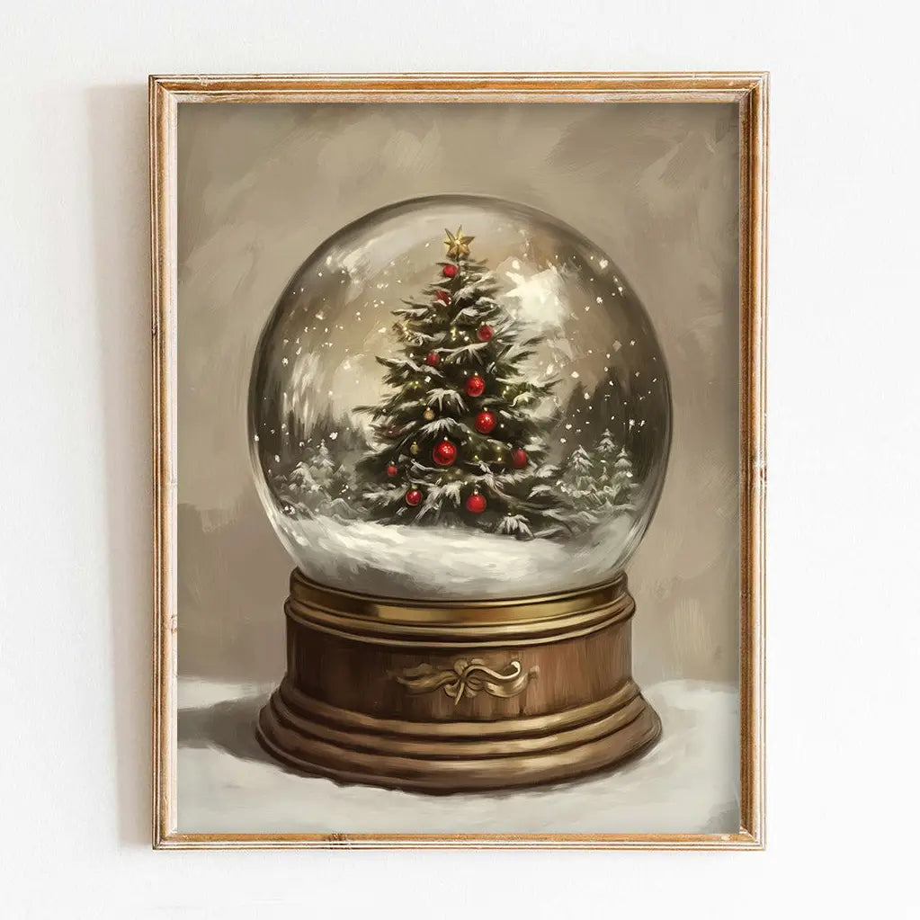 Framed artwork of a Christmas tree inside a snow globe on a white background