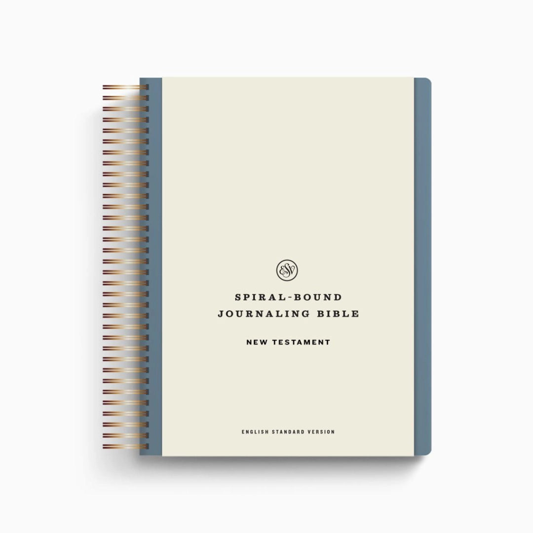 Spiral-bound journaling Bible with blue cover on a white background